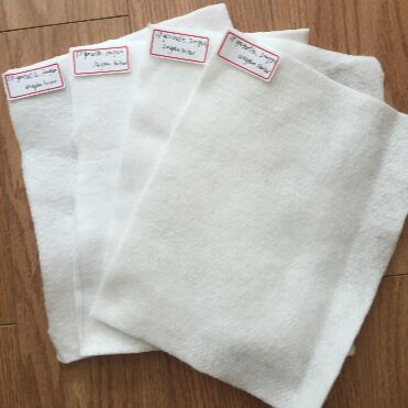 ผ้าใยสังเคราะห์โพลีเอสเตอร์แบบไม่ทอ (Non Woven Geotextile) ชนิดเส้นใยสั้นแบบเจาะเข็ม (Needle Punched) สำหรับเสริมกำลังพื้นทาง